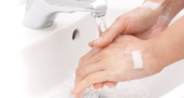 Washing hands under running water