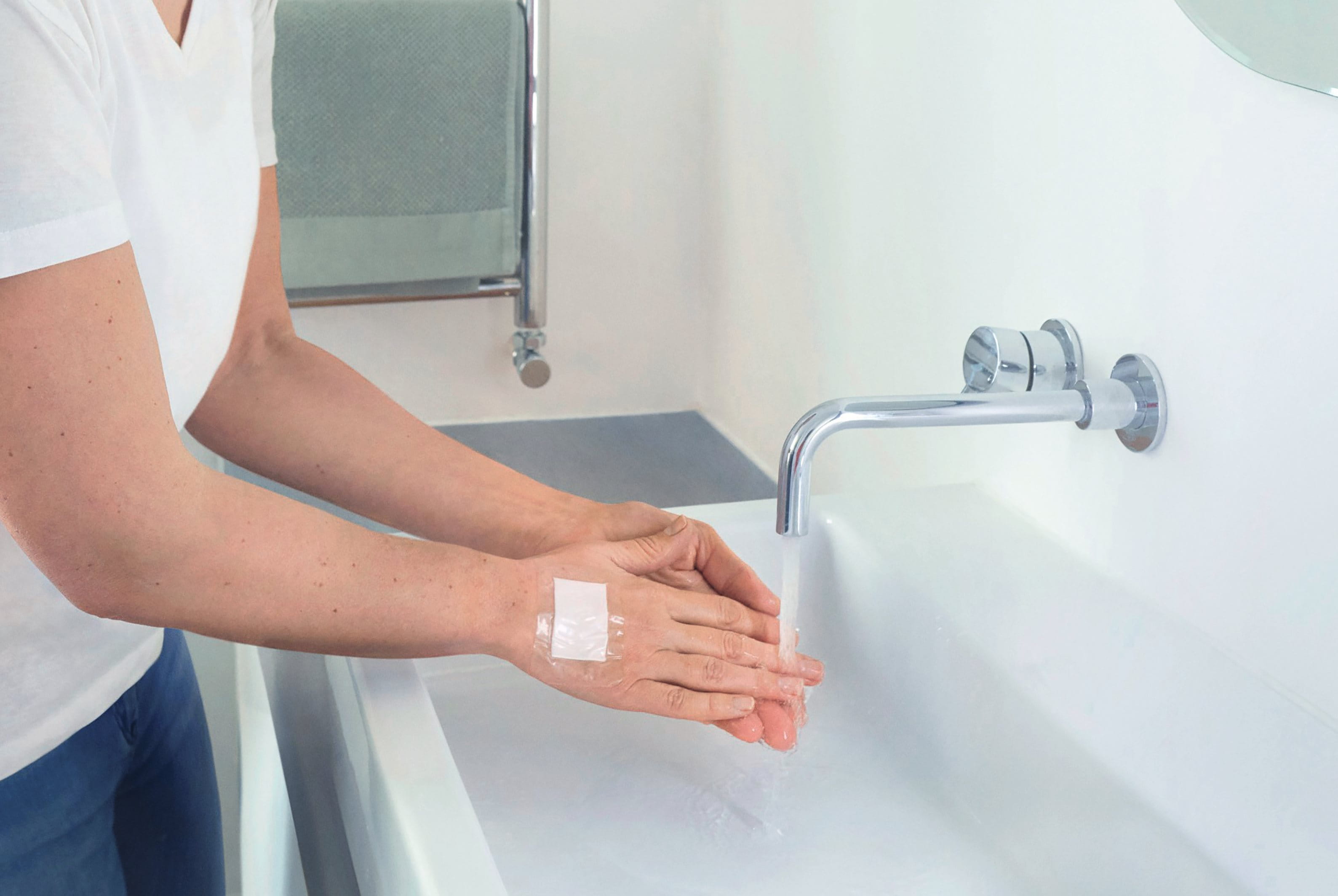 Woman in front of sink