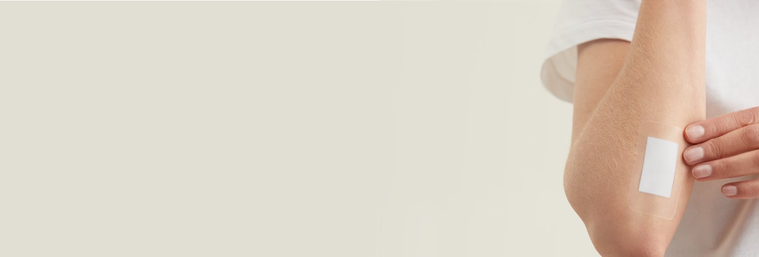 Close up shot of a large plaster on a forearm