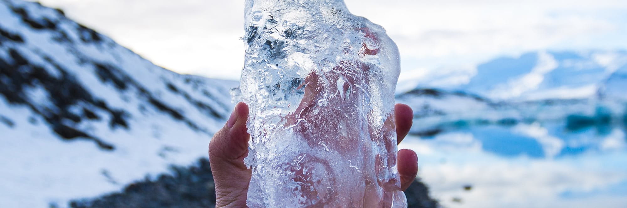 woman holding block of ice