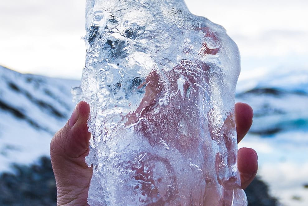 woman holding block of ice