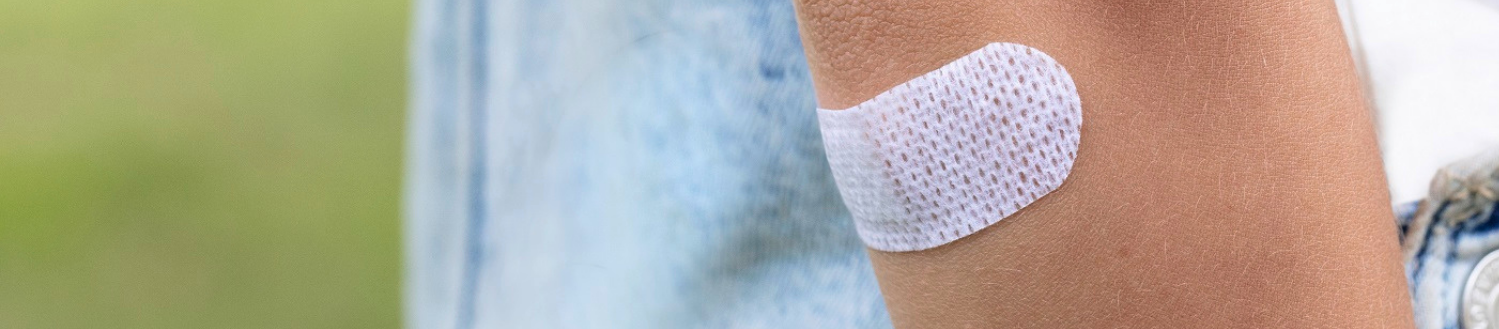 Young girl wearing Elastoplast plaster