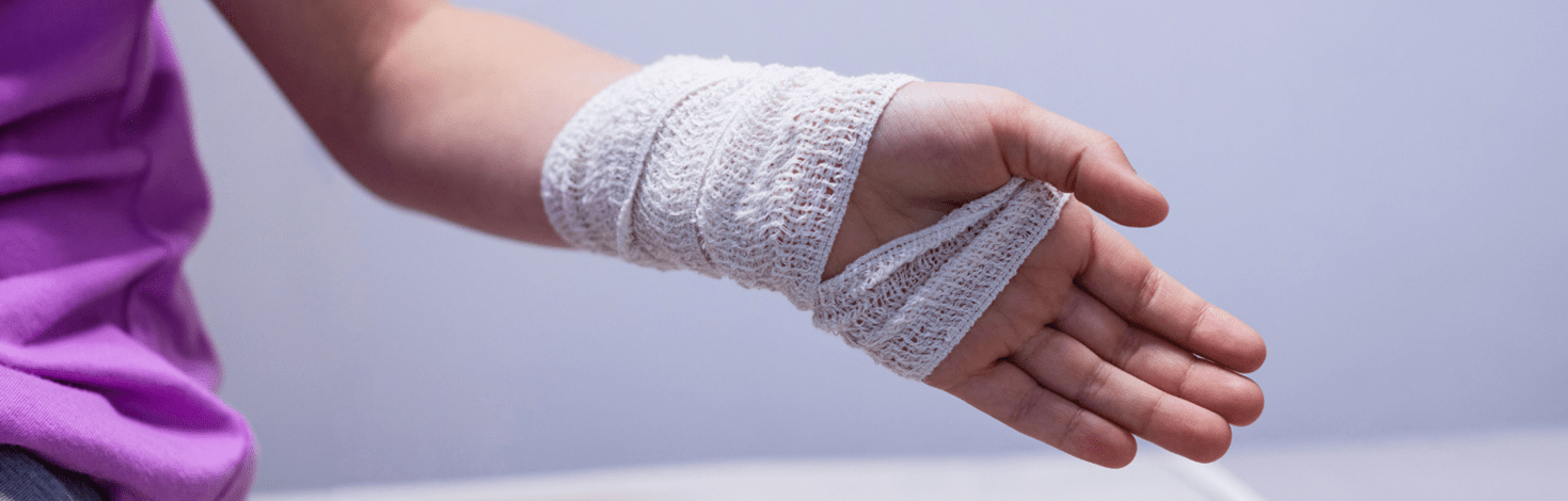 Woman with bandage on hand