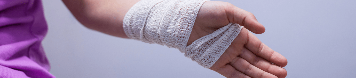 Woman with bandage on hand