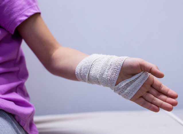 Woman with bandage on hand