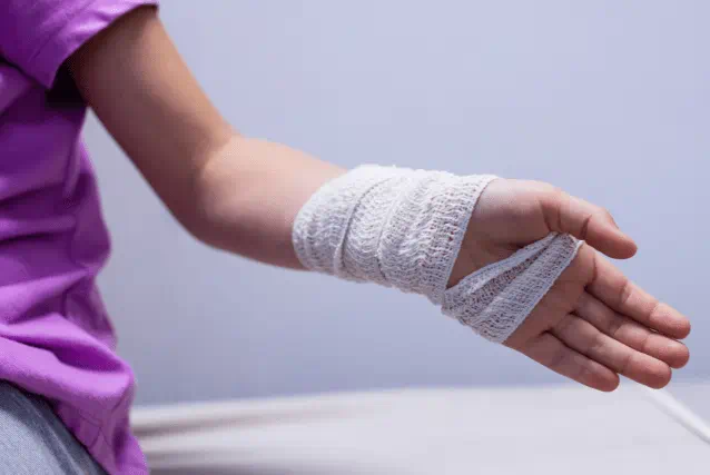 Woman with bandage on hand