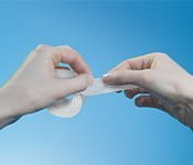 Cover the wound with the tape