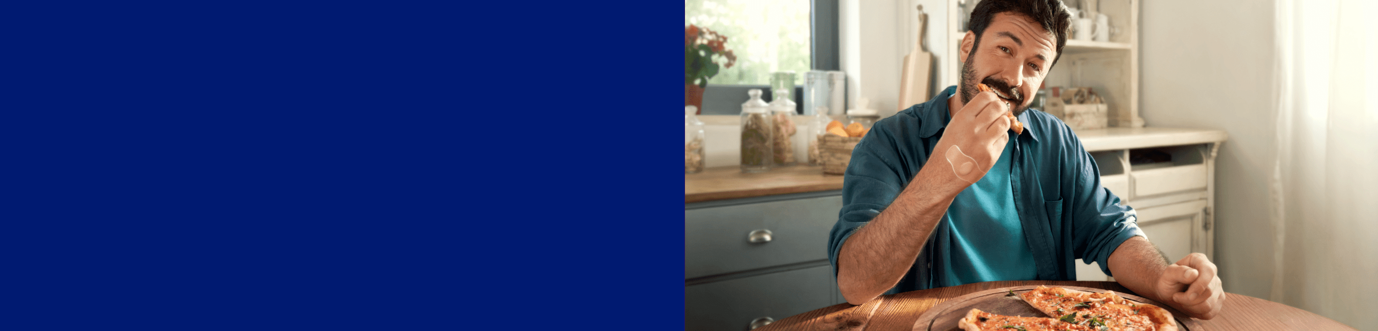 A girl has fun riding a go kart, on her knee a Hansaplast Elastic Plaster.