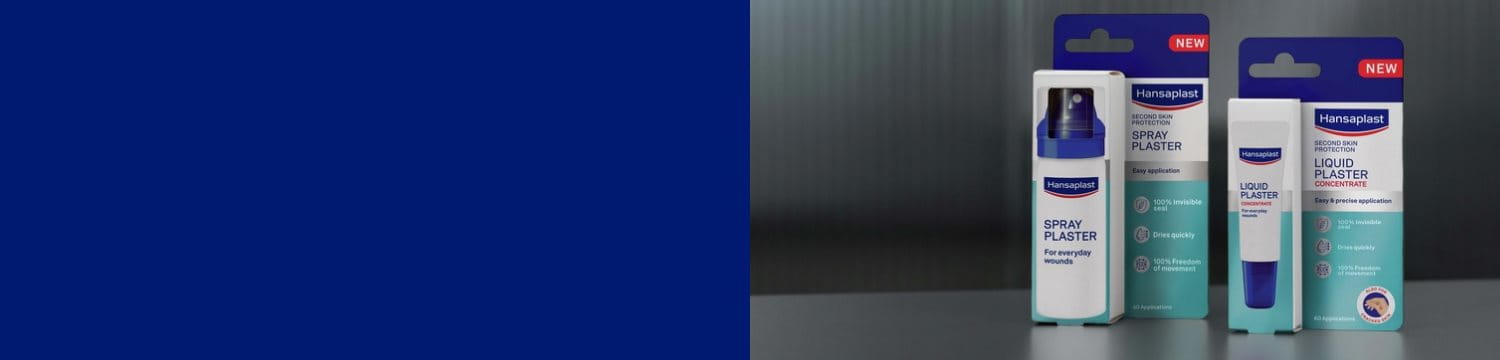 A grandmother is smiling while holding her grandchild. Parts of her right forearm are covered with a Hansaplast Ultra Sensitive Plaster in the new XXL size.