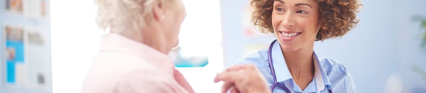 Doctor placing bandage on a wound